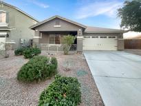Single-story house with a two-car garage and well-maintained landscaping at 6038 S Connie Ln, Gilbert, AZ 85298