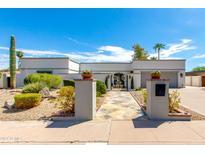 White single story home with landscaped front yard, gated entry and two car garage at 8219 N 3Rd Ave, Phoenix, AZ 85021