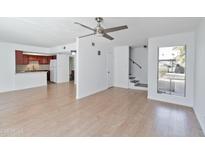 Bright living room with laminate floors and a view to the kitchen at 1051 S Dobson Rd # 165, Mesa, AZ 85202