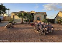 Single-story home with desert landscaping and a two-car garage at 10660 W Monaco Blvd, Arizona City, AZ 85123