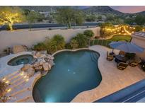 Inviting pool and spa surrounded by a beautifully landscaped backyard at 12067 N 135Th Way, Scottsdale, AZ 85259