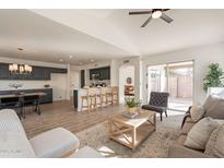 Open concept kitchen and living area with modern finishes and island at 18204 N 11Th Dr, Phoenix, AZ 85023