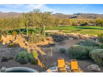 Spacious backyard with mountain views, pool, and lounge chairs at 19115 E Tonto Verde Dr, Rio Verde, AZ 85263