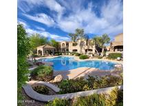 Relaxing resort-style pool with lush landscaping at 19475 N Grayhawk Dr # 2169, Scottsdale, AZ 85255