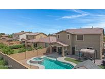 Aerial view of two story house with pool and backyard at 19538 N Crestview Ln, Maricopa, AZ 85138