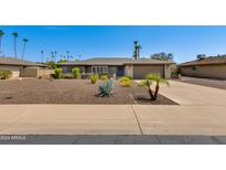 Single-story home with a landscaped front yard and driveway at 2011 E La Jolla Dr, Tempe, AZ 85282