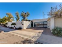 Stunning contemporary home with modern facade and landscaped yard at 2039 E Aspen Dr, Tempe, AZ 85282