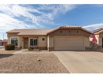 One-story house with tan exterior, two-car garage, and landscaped yard at 22516 N Via De La Caballa --, Sun City West, AZ 85375