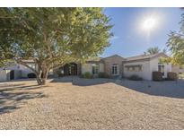 Single-story home with stone accents and a landscaped yard at 24435 S 195Th St, Queen Creek, AZ 85142