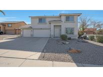 Two-story house with a two-car garage and desert landscaping at 277 E Windsor Ct, Gilbert, AZ 85296