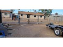 Backyard with chain link fence and trailer at 4854 W Berkeley Rd, Phoenix, AZ 85035