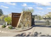 Canyon Reserve community entrance with modern stone and metal gate at 14425 S Canyon Dr, Phoenix, AZ 85048