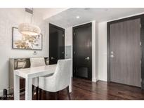 Modern condo dining area with white table and chairs at 4422 N 75Th St # 4006, Scottsdale, AZ 85251