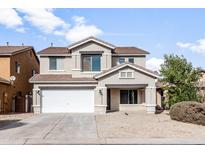 Two-story house with a white garage door and desert landscaping at 826 E Bradstock Way, San Tan Valley, AZ 85140