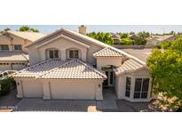 Two-story home with tile roof, two-car garage, and landscaped front yard at 951 N Forest Ct, Chandler, AZ 85226