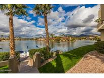 Scenic waterfront view with boats and lush landscaping at 10080 E Mountainview Lake Dr # 242, Scottsdale, AZ 85258