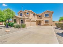 Two-story house with a three-car garage and well-manicured landscaping at 12503 S 175Th Ave, Goodyear, AZ 85338