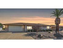 Brick ranch home with a two-car garage and desert landscaping at 12619 N Sun Valley Dr, Sun City, AZ 85351