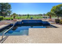 Inviting pool with golf course view; perfect for relaxation at 13105 W Micheltorena Dr, Sun City West, AZ 85375