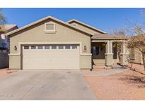 One-story house with a two-car garage and desert landscaping at 244 W Wier Ave, Phoenix, AZ 85041