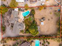 Aerial view of house, pool, and expansive lot at 6319 N Mockingbird Ln, Paradise Valley, AZ 85253