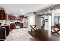 Modern kitchen with stainless steel appliances and granite countertops at 6622 N 43Rd Ave, Glendale, AZ 85301