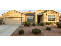 Single-story home with desert landscaping and a two-car garage at 3583 N Brooklyn Dr, Buckeye, AZ 85396