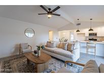 Bright living room with comfy seating and a view to the backyard at 4518 W Chicago St, Chandler, AZ 85226