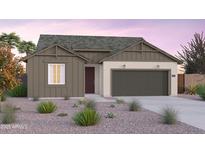 One-story home with craftsman style exterior, two-car garage, and desert landscaping at 10184 S Bickwell Trl, Apache Junction, AZ 85120