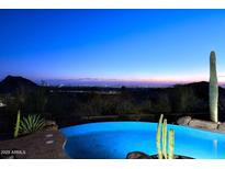 Stunning pool with city views at night at 12887 N 135 St, Scottsdale, AZ 85259