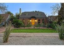 Charming brick home with a well-manicured lawn and updated front entrance at 1325 W Lynwood St, Phoenix, AZ 85007