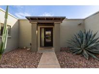 Inviting exterior with walkway, drought-tolerant landscaping, and covered entry at 16807 E Gunsight Dr # B23, Fountain Hills, AZ 85268