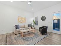 Bright living room with comfy seating, large windows, and stylish decor at 18815 N 34Th Ave # 4, Phoenix, AZ 85027