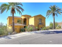 Stunning two-story house with stucco exterior, red tile roof, and palm trees at 2105 E Kerry Ln, Phoenix, AZ 85024