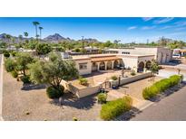 Aerial view of a stunning property with a large backyard, pool, and expansive patio at 3357 E Gold Dust Ave, Phoenix, AZ 85028