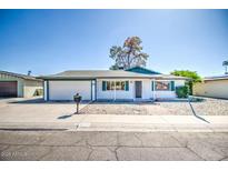 Charming single-story home featuring a well-maintained front yard, garage, and welcoming entrance at 4415 W Palo Verde Ave, Glendale, AZ 85302