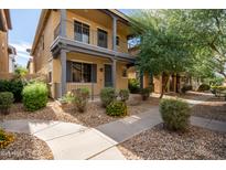 Two-story townhome with front porch and landscaped yard at 6845 S 7Th Ln, Phoenix, AZ 85041