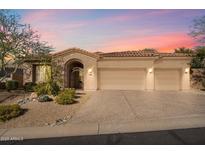 Beautiful desert home with three-car garage and landscaped front yard at 10638 E Blanche Dr, Scottsdale, AZ 85255