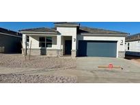 Newly constructed single-story home with attached garage at 15374 W Hackamore Dr, Surprise, AZ 85387