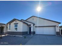 Single-story house with a two-car garage and neutral color scheme at 15429 W Hackamore Dr, Surprise, AZ 85387