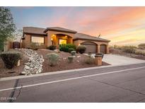 Beautiful two-story home with a three-car garage and desert landscaping at 15639 E Palomino Blvd, Fountain Hills, AZ 85268