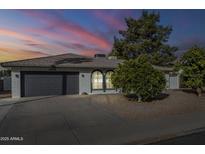 Beautiful single-story home with a gray garage door and landscaping at 2818 S Cottonwood Dr, Tempe, AZ 85282