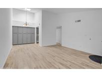 Bright dining area with gray cabinets and wood-look tile floors at 629 N Mesa Dr # 29, Mesa, AZ 85201