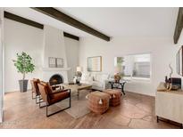 Bright living room with fireplace, hardwood floors, and comfortable seating at 6309 N 14Th St, Phoenix, AZ 85014