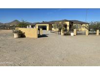 Desert landscape home with gated entry and large yard at 8210 S 132Nd Ave, Goodyear, AZ 85338