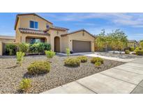 Two-story house with a two-car garage and landscaped front yard at 18749 W San Miguel Ave, Litchfield Park, AZ 85340