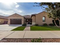 One-story home with a two-car garage and landscaped front yard at 20975 E Camina Buena Vista Ct, Queen Creek, AZ 85142