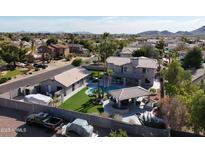 Aerial view of two-story home with pool, casita and large backyard at 4530 W Misty Willow Ln, Glendale, AZ 85310