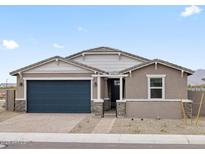 Charming single-story home featuring a two-car garage, neutral stucco, and a desert landscape at 4816 N 177Th Ln, Goodyear, AZ 85395