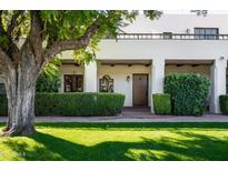 Spanish style home with a courtyard and lush landscaping at 5101 N Casa Blanca Dr # 9, Paradise Valley, AZ 85253